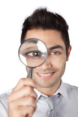 Image showing Businessman Holding Magnifying Glass