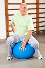 Image showing Senior Man Sitting On Fitness Ball