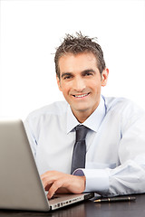 Image showing Businessman Using Laptop at Work