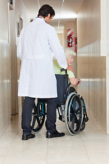 Image showing Doctor With Woman In Wheel