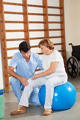 Image showing Therapist Examining Senior Woman's Knee