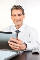 Image showing Businessman Holding Digital Tablet