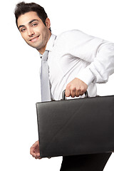 Image showing Young Businessman Holding Suitcase