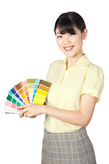 Image showing Young Woman Showing Color Chart