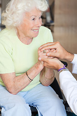 Image showing Doctor Comforting Senior Woman