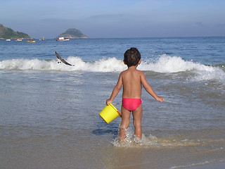 Image showing Kid playing in the beach