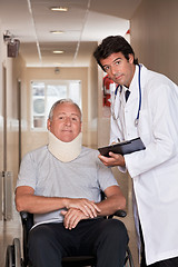 Image showing Doctor with Patient in Wheelchair