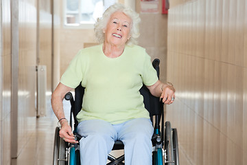 Image showing Happy Senior Woman Sitting In a Wheel Chair