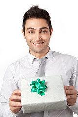 Image showing Young Businessman Holding Gift Box