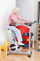 Image showing Senior Woman Exercising On Bike