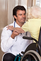 Image showing Doctor with Patient on Wheel Chair