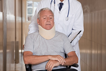 Image showing Doctor with Patient in Wheelchair