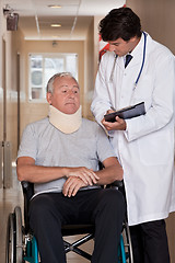 Image showing Doctor with Patient in Wheelchair