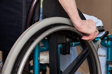 Image showing Woman's Hands on Wheelchair