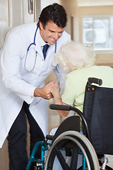 Image showing Doctor Assisting Senior Woman In Wheelchair