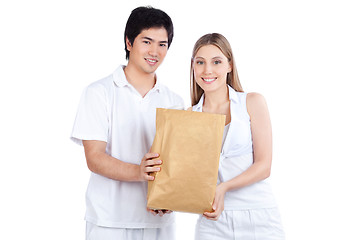 Image showing Young Couple  Holding Paper Bag