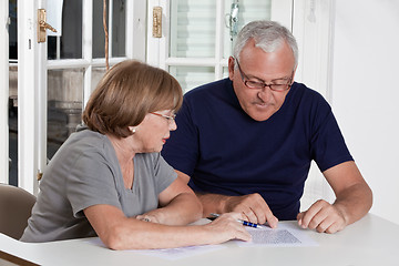 Image showing Mature Couple playing Scrabble Game