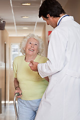 Image showing Doctor helping Patient use Walking Stick