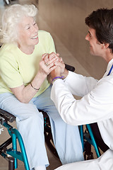 Image showing Doctor with Patient on Wheel Chair