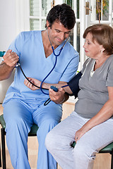 Image showing Doctor taking the Blood Pressure