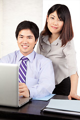 Image showing Businessman and Businesswoman at Work