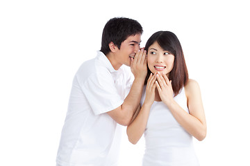 Image showing Man Whispering Woman's Ear