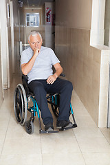 Image showing Sad Senior Man Sitting In a Wheelchair