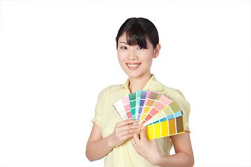 Image showing Young Woman Showing Color Chart