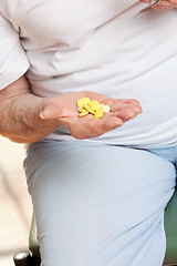 Image showing Senior Female Patient Holding Tablets