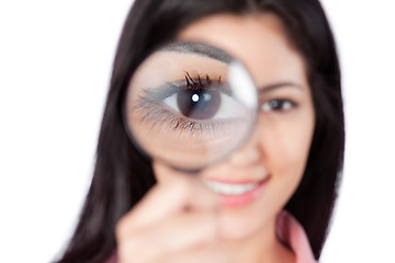 Image showing Woman Holding Magnifying Glass