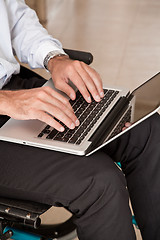 Image showing Man on Wheelchair Using Laptop