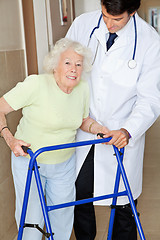 Image showing Senior Woman Being Assisted By Doctor