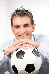 Image showing Businessman with Football at Work