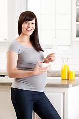 Image showing Pregnant Woman Eating Breakfast