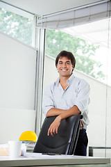 Image showing Architect Standing By Office Chair