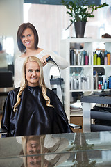 Image showing Woman Getting Her Hair Curled