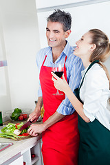 Image showing Laughing Couple Cooking in Kitchen