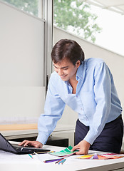 Image showing Male Interior Designer Using Laptop