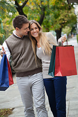 Image showing Couple Walking Leisurely On Sidewalk