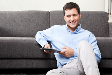 Image showing Young Man Holding Digital Tablet