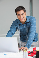 Image showing Tailor Using Laptop At Work
