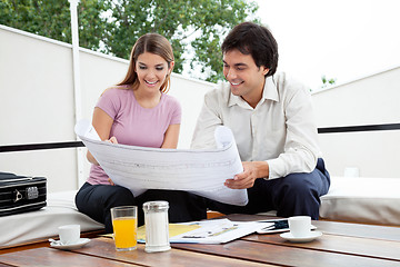 Image showing Female Looking At House Plan