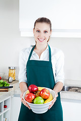 Image showing Woman with Fruit in Kitchen