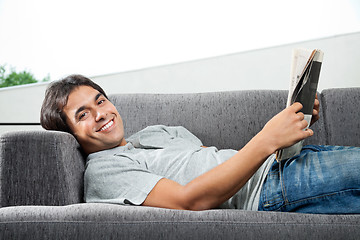 Image showing Man Holding Magazine