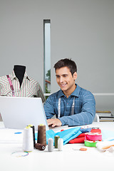 Image showing Happy Tailor Working On Laptop