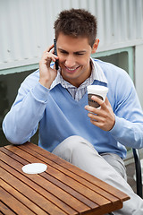 Image showing Man On A Call At Cafe