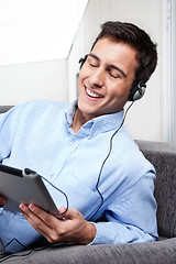 Image showing Relaxed Young Man on Couch