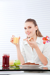 Image showing Young Woman Having Breakfast