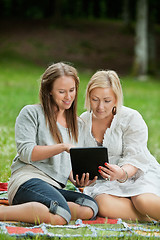 Image showing Mother And Daughter Using Digital Tablet