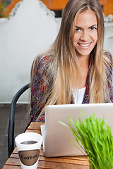 Image showing Beautiful Woman With Laptop At Cafe
